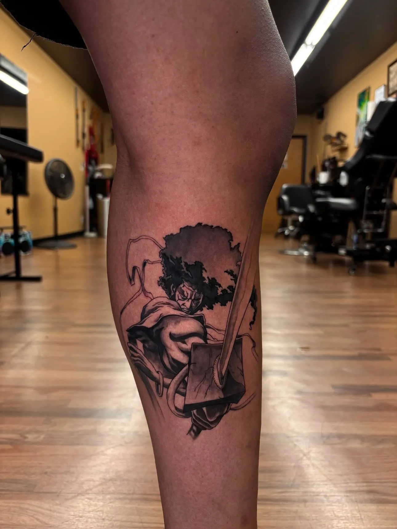 Afro Samurai calf tattoo