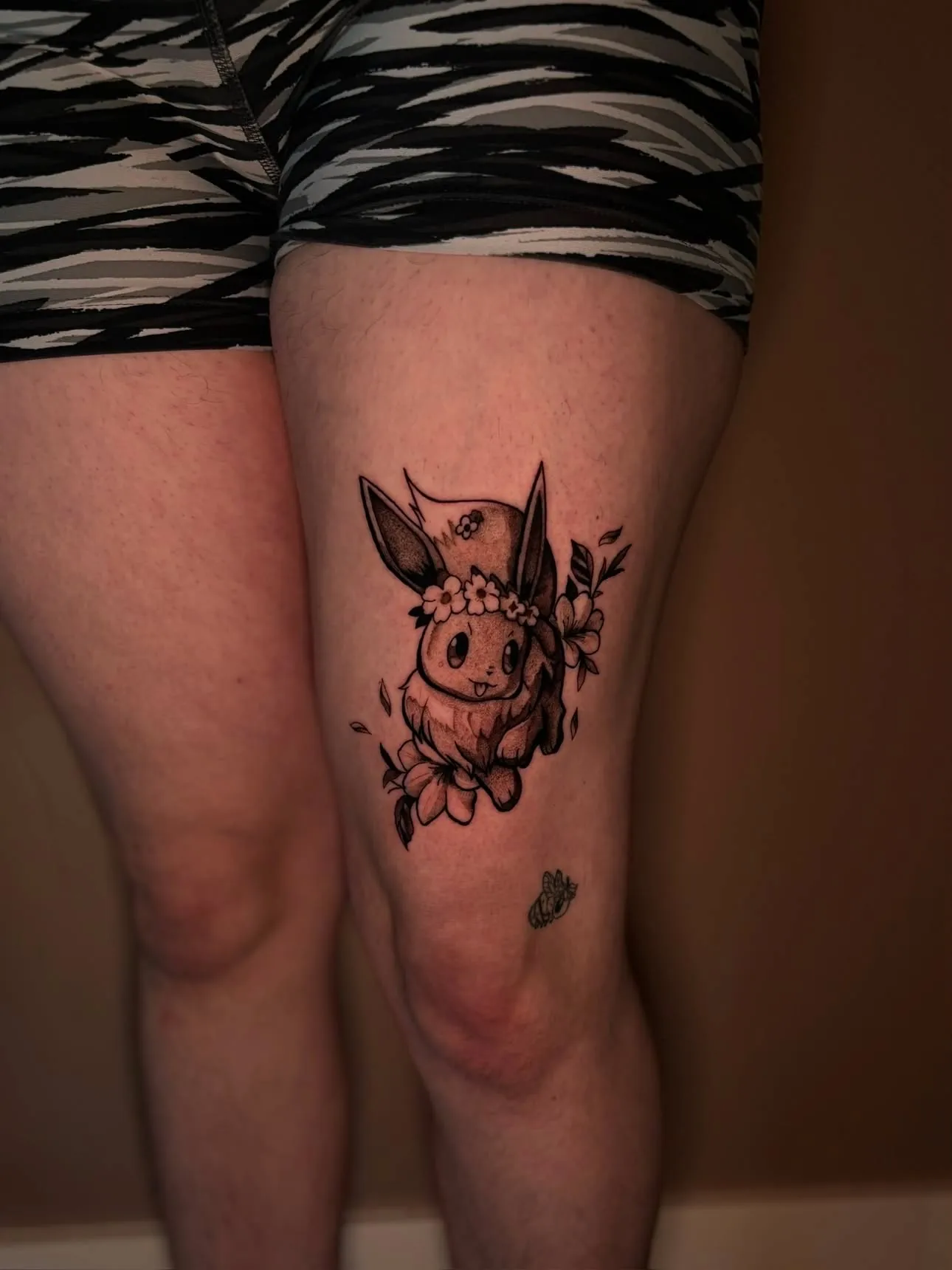 Eevee Pokémon thigh tattoo