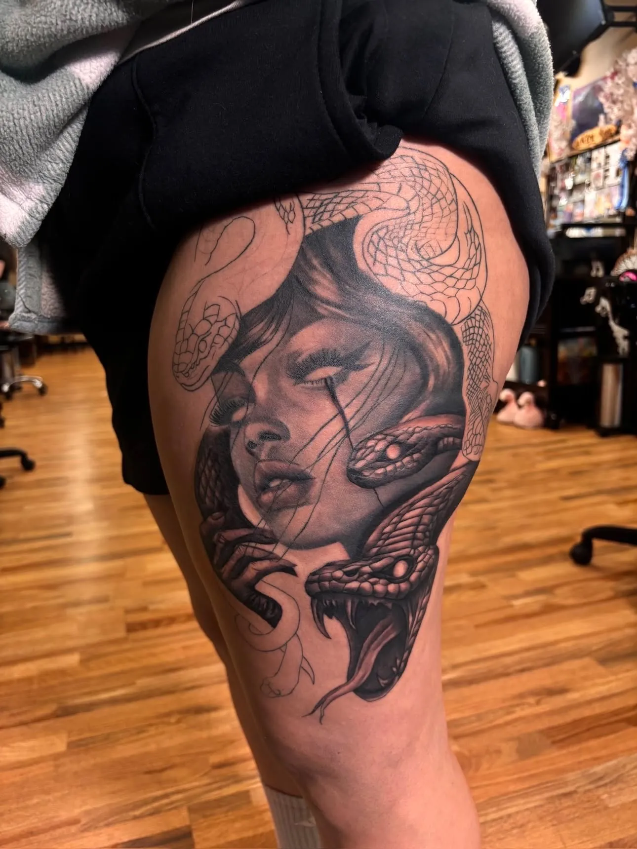 Medusa blackwork thigh tattoo