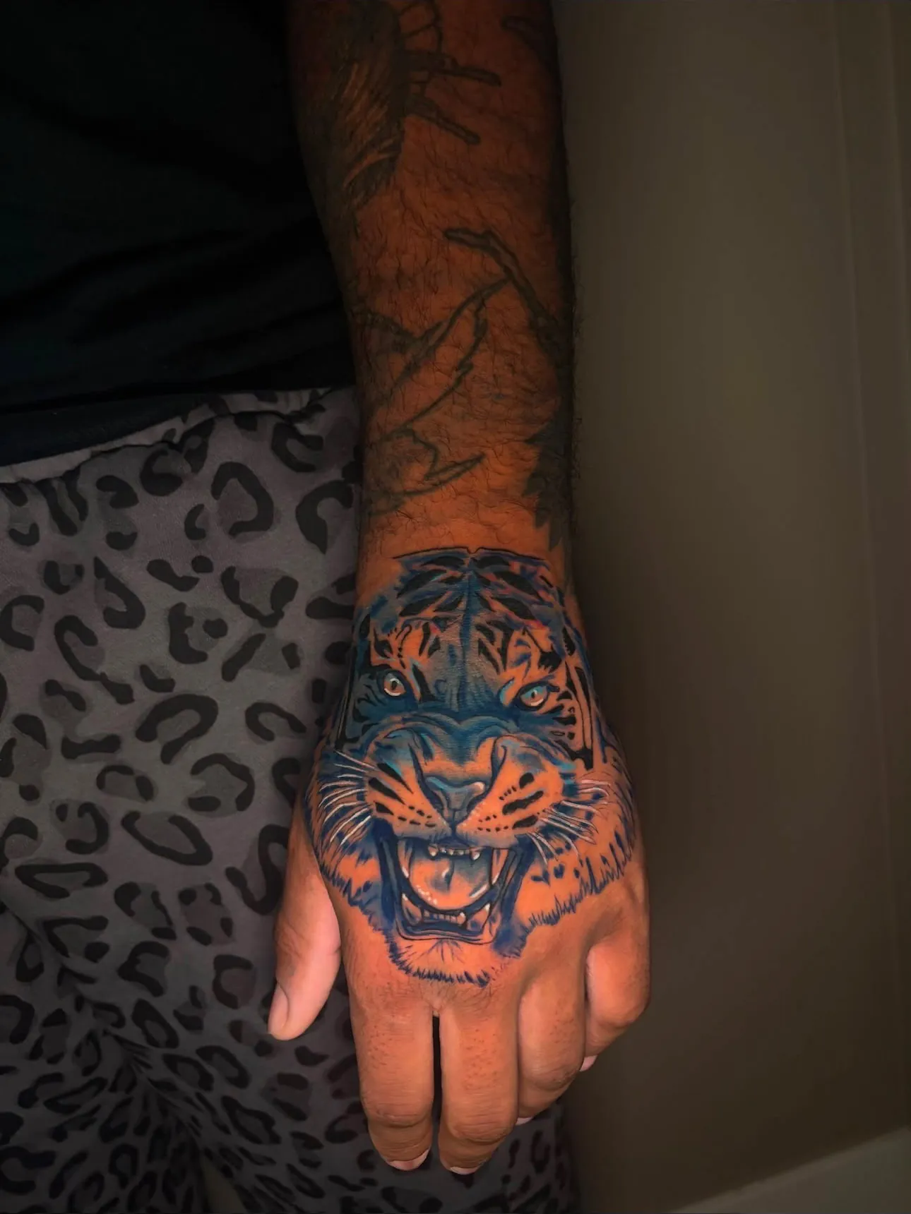 Tiger palm tattoo in color realism